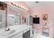 Fresh bathroom featuring a long vanity, a large mirror, and a glass-door shower at 3603 Westerham Dr, Clermont, FL 34711