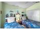 Comfortable bedroom featuring twin beds, ample storage, and bright, airy atmosphere at 3603 Westerham Dr, Clermont, FL 34711