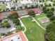 Aerial view of community park with tennis and basketball courts, shuffleboard, and picnic area at 3603 Westerham Dr, Clermont, FL 34711