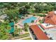 Overhead view of community pool, showing the spa, lounge area, and lush landscaping at 3603 Westerham Dr, Clermont, FL 34711