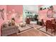 Bright living room featuring cozy seating, unique lighting, and an open-concept design at 3603 Westerham Dr, Clermont, FL 34711
