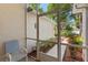 Relaxing screened patio features a chair with garden views at 3603 Westerham Dr, Clermont, FL 34711