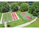 Aerial view of recreation area including a shuffleboard, bocce ball and basketball court at 3603 Westerham Dr, Clermont, FL 34711