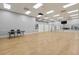 Spacious recreation room with hardwood floors, mirrored wall, and ample lighting for activities at 3603 Westerham Dr, Clermont, FL 34711