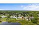 Aerial view of homes shows lake, neighborhood, and partial fencing at 37132 Turner Dr, Umatilla, FL 32784