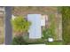 Aerial view of the home with a gray roof, wooden deck, and green backyard at 37132 Turner Dr, Umatilla, FL 32784