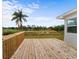 New wooden deck overlooking the backyard and serene waterfront view at 37132 Turner Dr, Umatilla, FL 32784