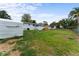 Large backyard features a shed, screened in porch, and a partially fenced yard at 37132 Turner Dr, Umatilla, FL 32784