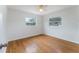Well-lit bedroom boasts hardwood floors and windows that allow natural light at 37132 Turner Dr, Umatilla, FL 32784