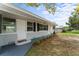 This home has a quaint front porch and well maintained yard with flowering bushes at 37132 Turner Dr, Umatilla, FL 32784