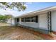 This home has a quaint front porch and well maintained yard with flowering bushes at 37132 Turner Dr, Umatilla, FL 32784