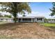 Charming single-story home features a well-manicured lawn, mature shade tree, and inviting curb appeal at 37132 Turner Dr, Umatilla, FL 32784