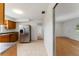 Bright kitchen featuring a refrigerator and an entryway to other rooms at 37132 Turner Dr, Umatilla, FL 32784