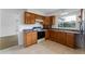 Functional kitchen with wooden cabinets, providing ample storage and functionality at 37132 Turner Dr, Umatilla, FL 32784