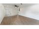 Spacious living room featuring hardwood flooring, ceiling fan and white walls at 37132 Turner Dr, Umatilla, FL 32784