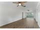 This home offers a light and airy living space with wood floors and a sliding glass door to the lanai at 37132 Turner Dr, Umatilla, FL 32784
