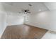 Bright, open living room with ceiling fan, recessed lighting, and wood flooring at 37132 Turner Dr, Umatilla, FL 32784