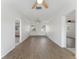 Welcoming living room featuring neutral paint, wood floors, and easy access to other rooms at 37132 Turner Dr, Umatilla, FL 32784