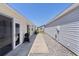 Backyard featuring an outdoor grill, patio, and walkway; perfect for entertaining at 3756 Viscaya Ct, The Villages, FL 32163