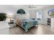 Inviting bedroom features hardwood floors, a fan, and bedside lamps for a cozy atmosphere at 3756 Viscaya Ct, The Villages, FL 32163