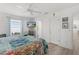 Bright bedroom with ceiling fan, window, and wood floors with a TV for convenience at 3756 Viscaya Ct, The Villages, FL 32163