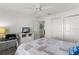 Bright bedroom featuring a ceiling fan, closet, desk, and TV at 3756 Viscaya Ct, The Villages, FL 32163