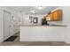 Well-lit kitchen area with open layout, adjacent to doorways and plenty of counter space at 3756 Viscaya Ct, The Villages, FL 32163