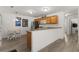 View of stainless steel refrigerator and breakfast bar, and breakfast nook at 3756 Viscaya Ct, The Villages, FL 32163