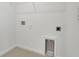 Empty laundry room featuring hookups for washer and dryer, ample space for laundry appliances and cleaning supplies at 4118 Penelope Ave, Lake Wales, FL 33859