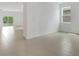 A bright and open living space featuring tile floors and large sliding doors at 4118 Penelope Ave, Lake Wales, FL 33859