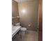 Bathroom with a toilet and a sink at 4294 Nimons St, Orlando, FL 32811