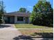 Single Gathering home featuring lawn, carport, and neutral toned exterior at 4294 Nimons St, Orlando, FL 32811