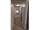 Hallway with tile flooring that leads to an open room with ample light at 4294 Nimons St, Orlando, FL 32811