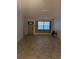 Spacious living room with tile flooring, a front door, and plenty of natural light at 4294 Nimons St, Orlando, FL 32811