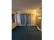 Comfortable carpeted living room with warm lighting, ready for your personal touches at 4294 Nimons St, Orlando, FL 32811