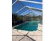 Outdoor pool with a screen enclosure and patio at 4294 Nimons St, Orlando, FL 32811