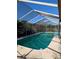 Enclosed pool area, perfect for cooling off on hot summer days and relaxing, features pool-cleaning robot at 4294 Nimons St, Orlando, FL 32811