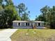 Charming single-story home featuring a well-maintained lawn and classic curb appeal at 43740 Sunset Dr, Paisley, FL 32767
