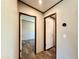 A hallway with wood-look flooring offering easy access to other rooms at 43740 Sunset Dr, Paisley, FL 32767