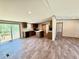 Well-lit kitchen featuring an island and access to outdoor space, ideal for entertaining at 43740 Sunset Dr, Paisley, FL 32767