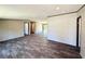 Open-concept living room featuring modern flooring, neutral walls, and bright, inviting space at 43740 Sunset Dr, Paisley, FL 32767