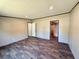 Inviting living room featuring wood-look vinyl floors and a neutral color scheme, ideal for relaxing at 43740 Sunset Dr, Paisley, FL 32767