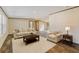Inviting living room with neutral tones, wood floors, and comfortable seating arrangement at 43740 Sunset Dr, Paisley, FL 32767