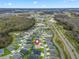 Expansive aerial shot showcases a residential community surrounded by natural landscapes at 4406 Creighton Loop, The Villages, FL 32163