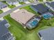 Aerial view of home featuring a screened-in pool and well-maintained landscaping at 4406 Creighton Loop, The Villages, FL 32163