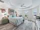 Stylish bedroom with natural light, tray ceiling, and calming color palette at 4406 Creighton Loop, The Villages, FL 32163