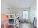 Playful ' bedroom featuring bunk beds, colorful decor, and ample closet space at 4406 Creighton Loop, The Villages, FL 32163