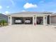 Spacious three-car garage providing ample parking and storage space for vehicles and equipment at 4406 Creighton Loop, The Villages, FL 32163