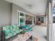 Relaxing screened patio with comfortable seating and views of the backyard and pool at 4406 Creighton Loop, The Villages, FL 32163