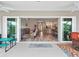 Indoor/outdoor living with sliding doors that lead to the open-concept floor plan at 4406 Creighton Loop, The Villages, FL 32163